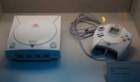 A Sega Dreamcast and its controller.