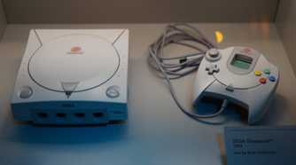 A Sega Dreamcast and its controller.