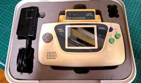 The rare white Sega Game Gear in its case.