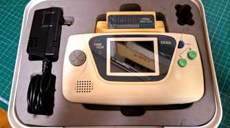 The rare white Sega Game Gear in its case.