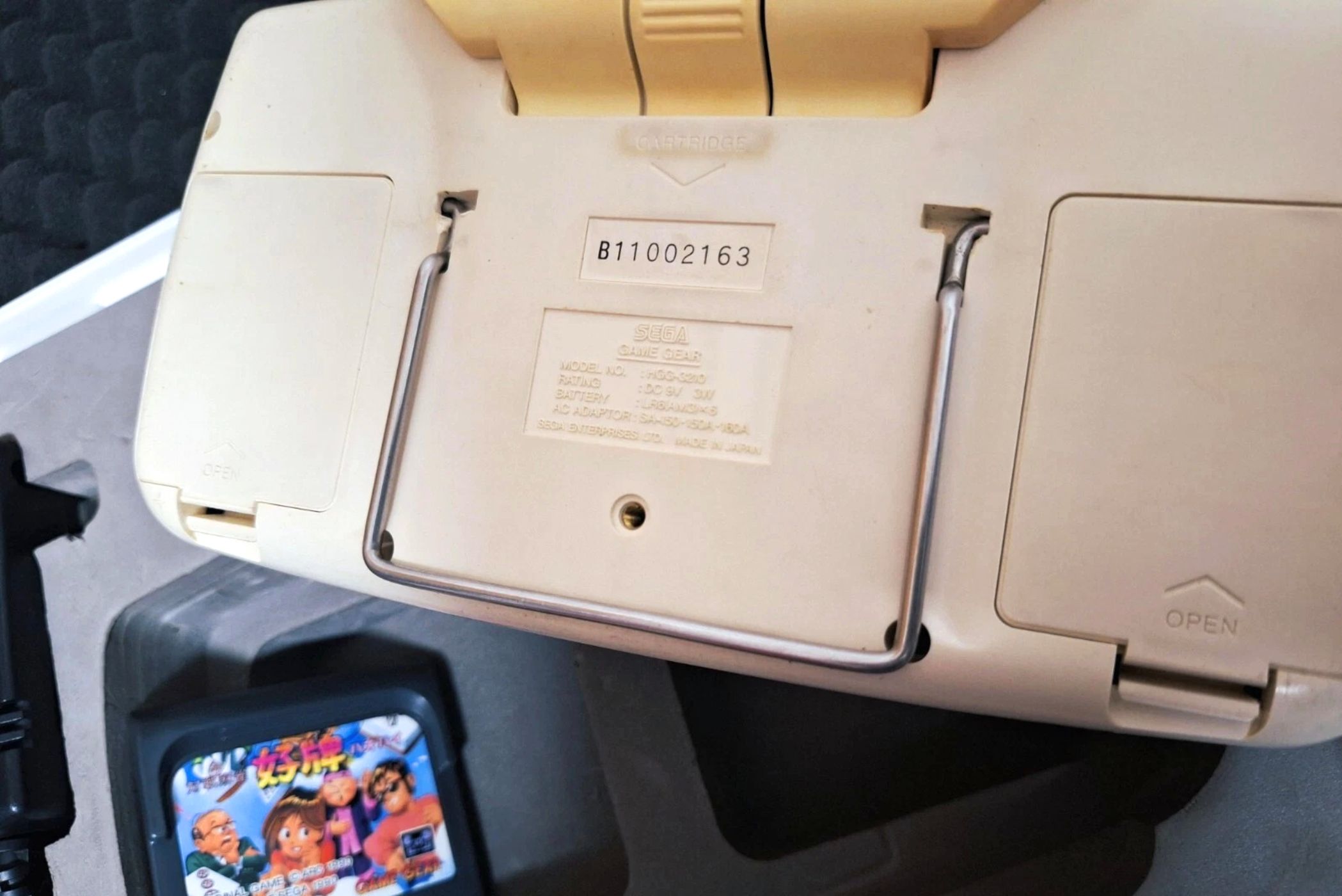 The rear of a white Sega Game Gear.