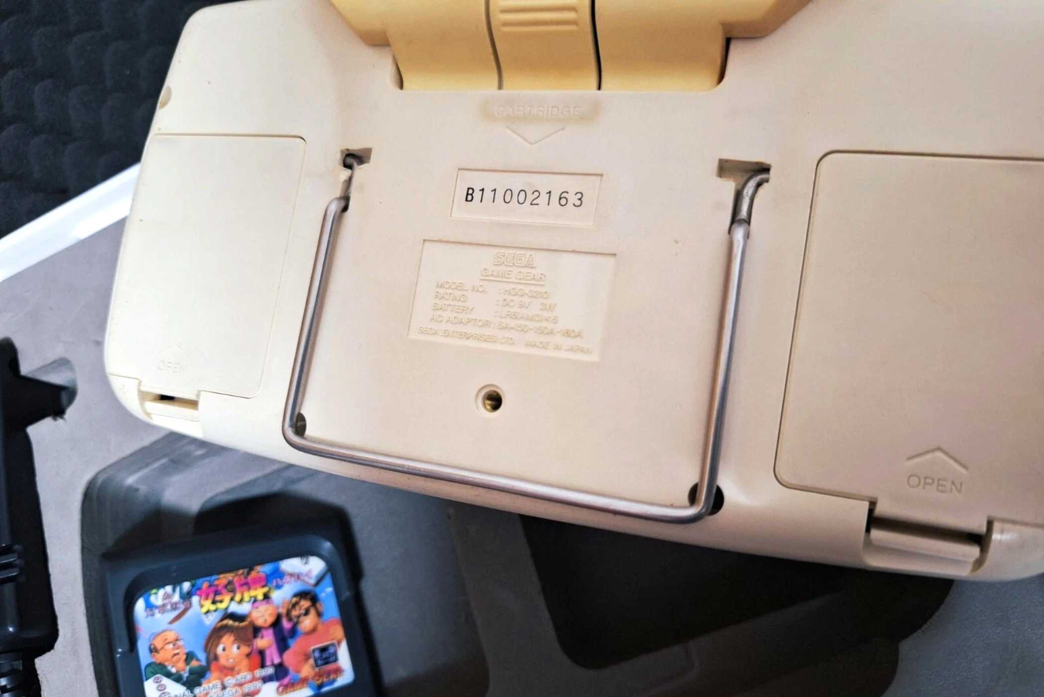 The rear of a white Sega Game Gear.