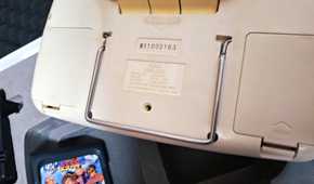 The rear of a white Sega Game Gear.