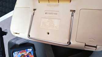 The rear of a white Sega Game Gear.