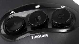 Face buttons on a Sega Genesis controller.