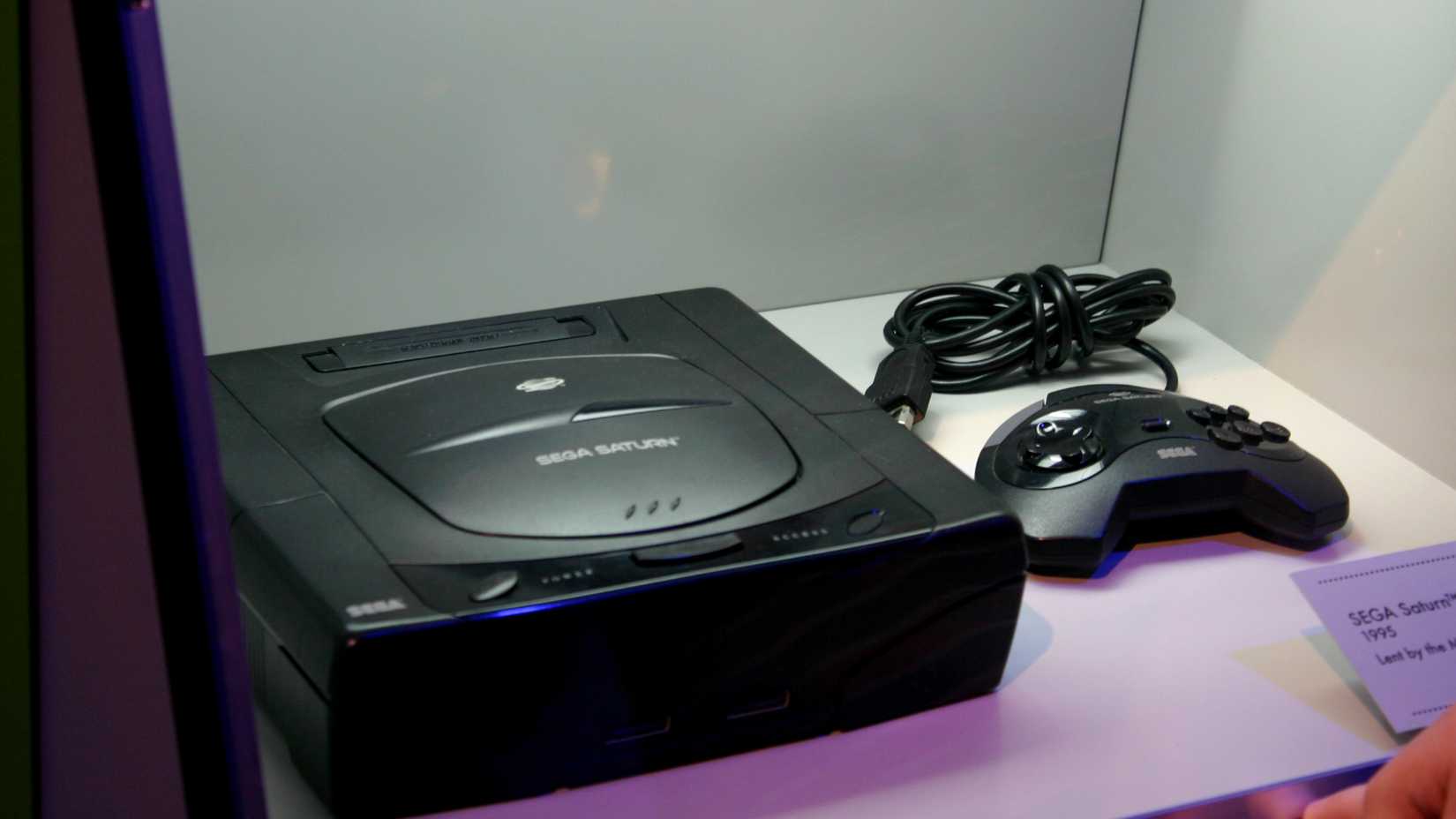 A Sega Saturn console encased.