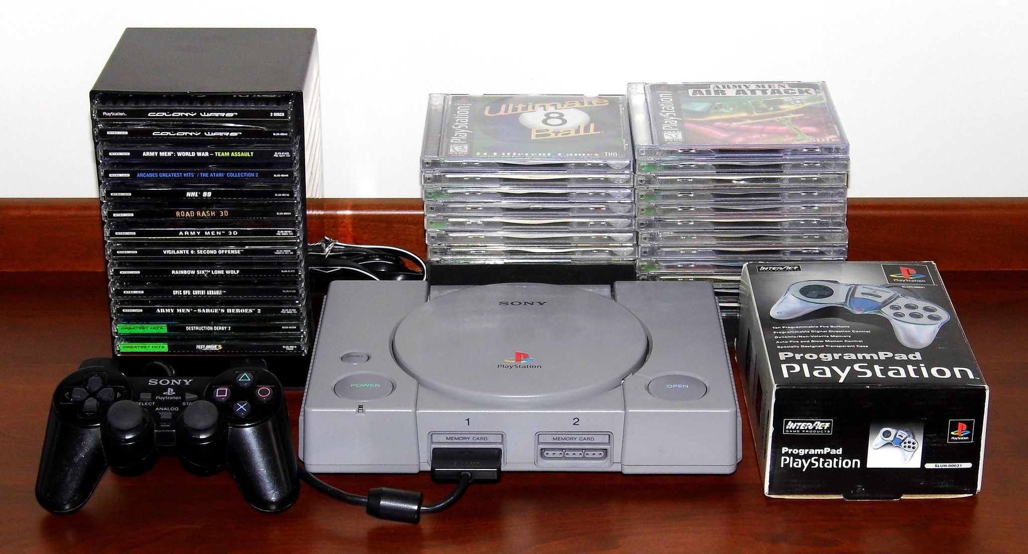 Sony PlayStation 1 with games and a controller.
