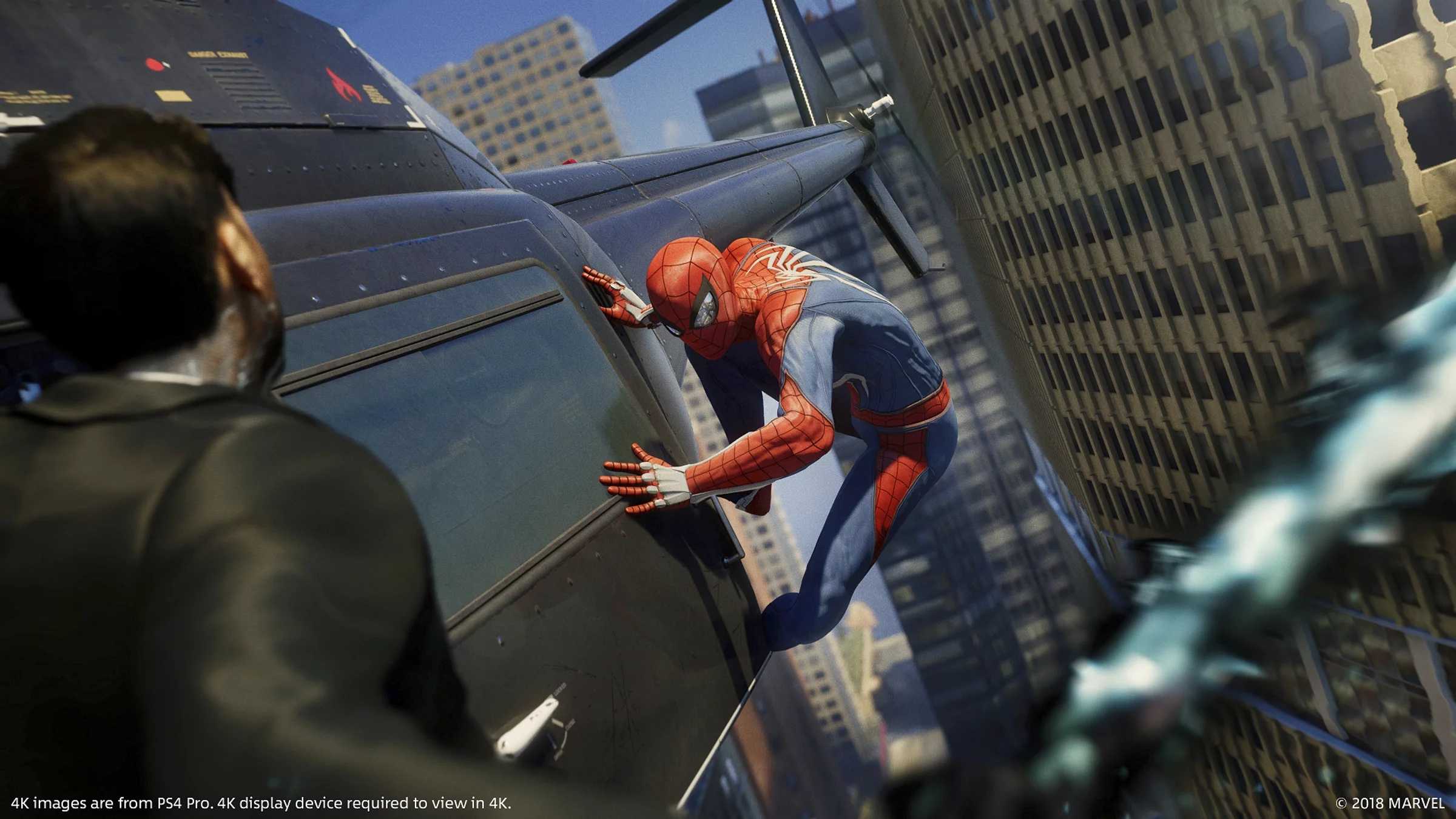 Spider-Man sticking to the side of a helicopter in Spider-Man 2018.