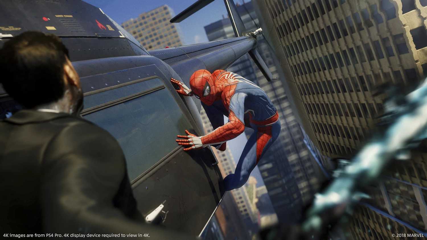 Spider-Man sticking to the side of a helicopter in Spider-Man 2018.