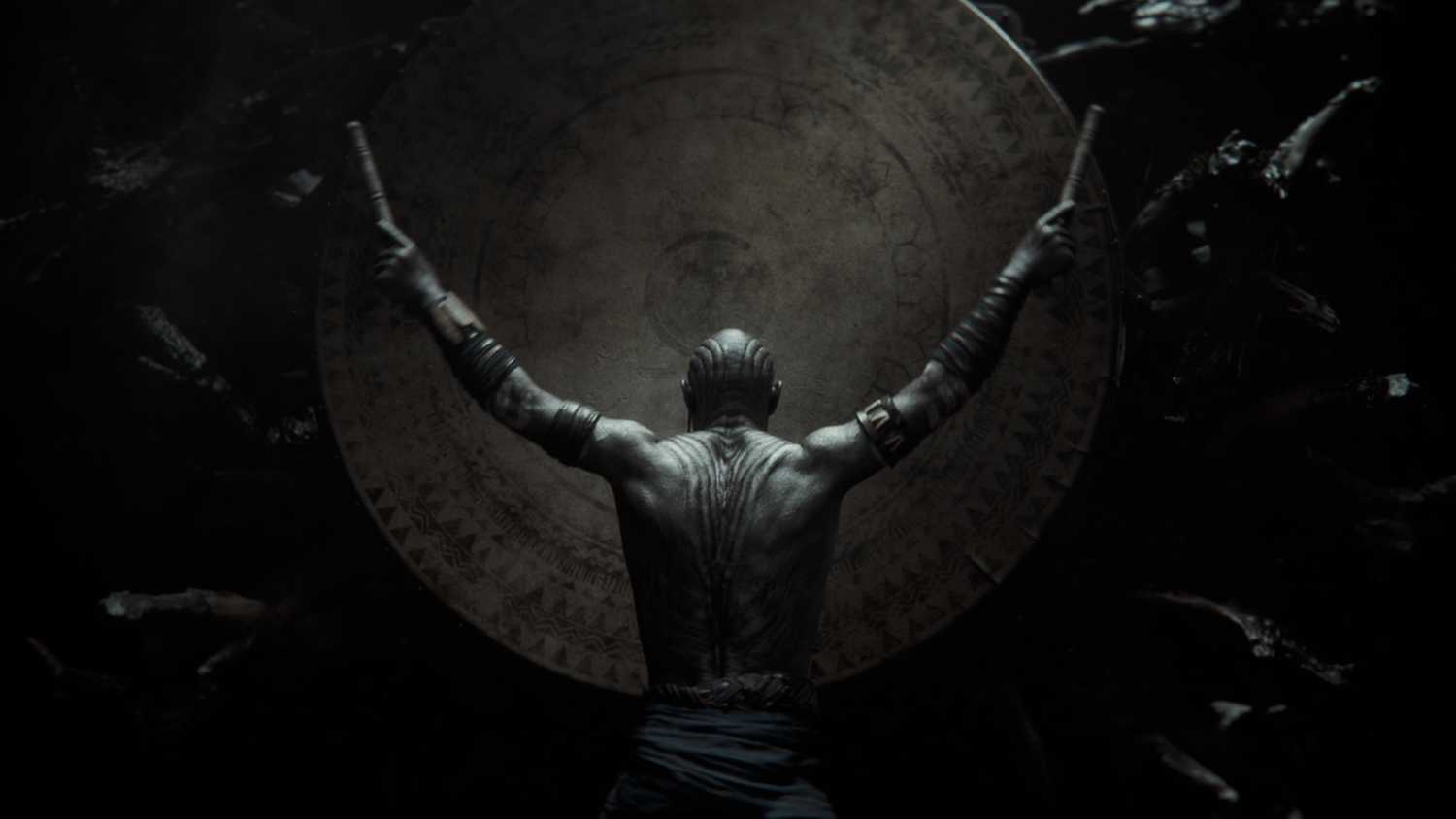A man banging a drum wedged in between tree roots in Star Wars Eclipse.