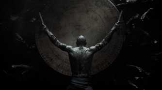 A man banging a drum wedged in between tree roots in Star Wars Eclipse.