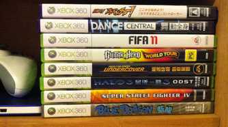 Disc version of Xbox 360 games stacked.