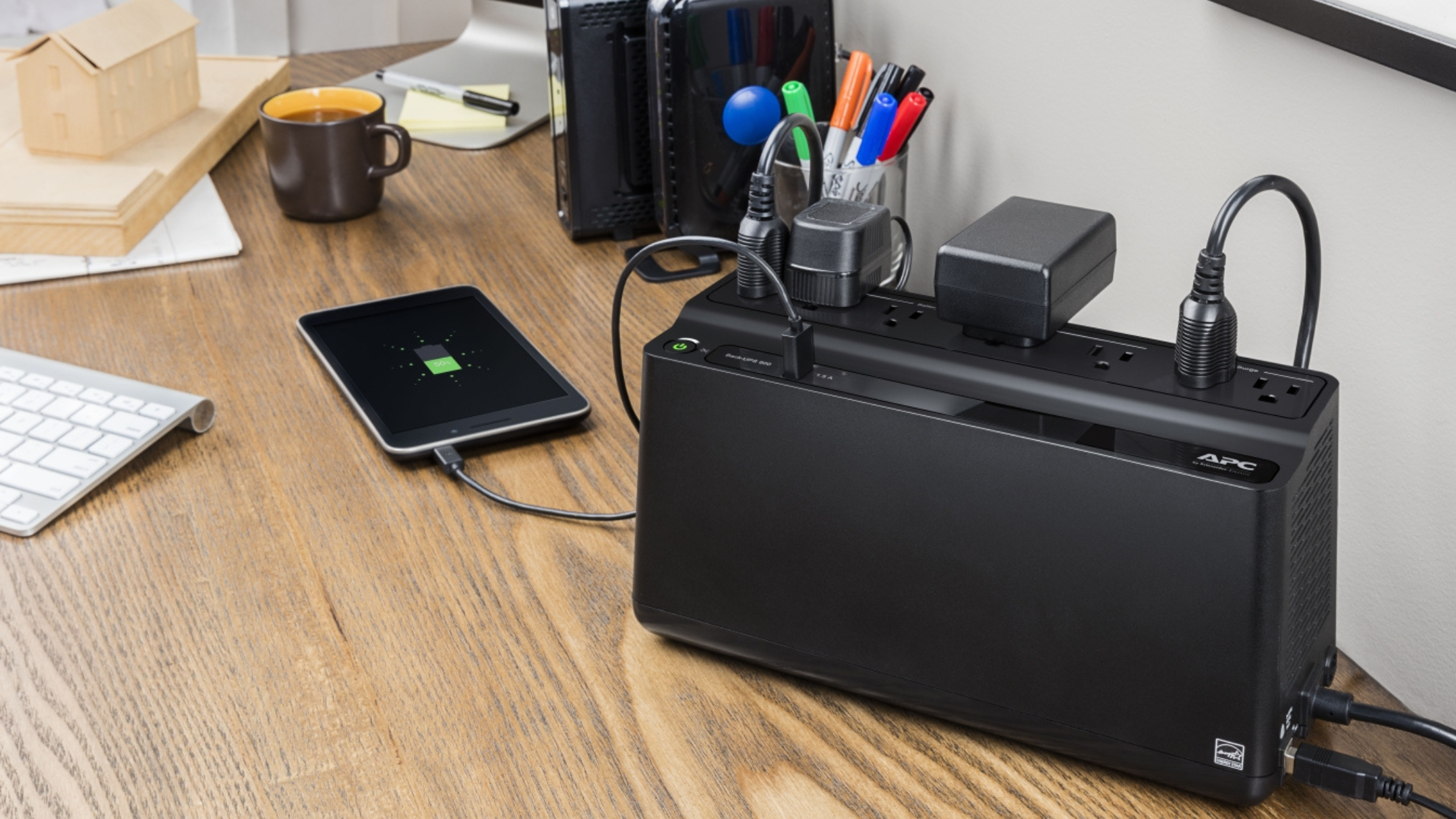 APC BE600M1 Back-UPS with USB Charger Port plugged into phone