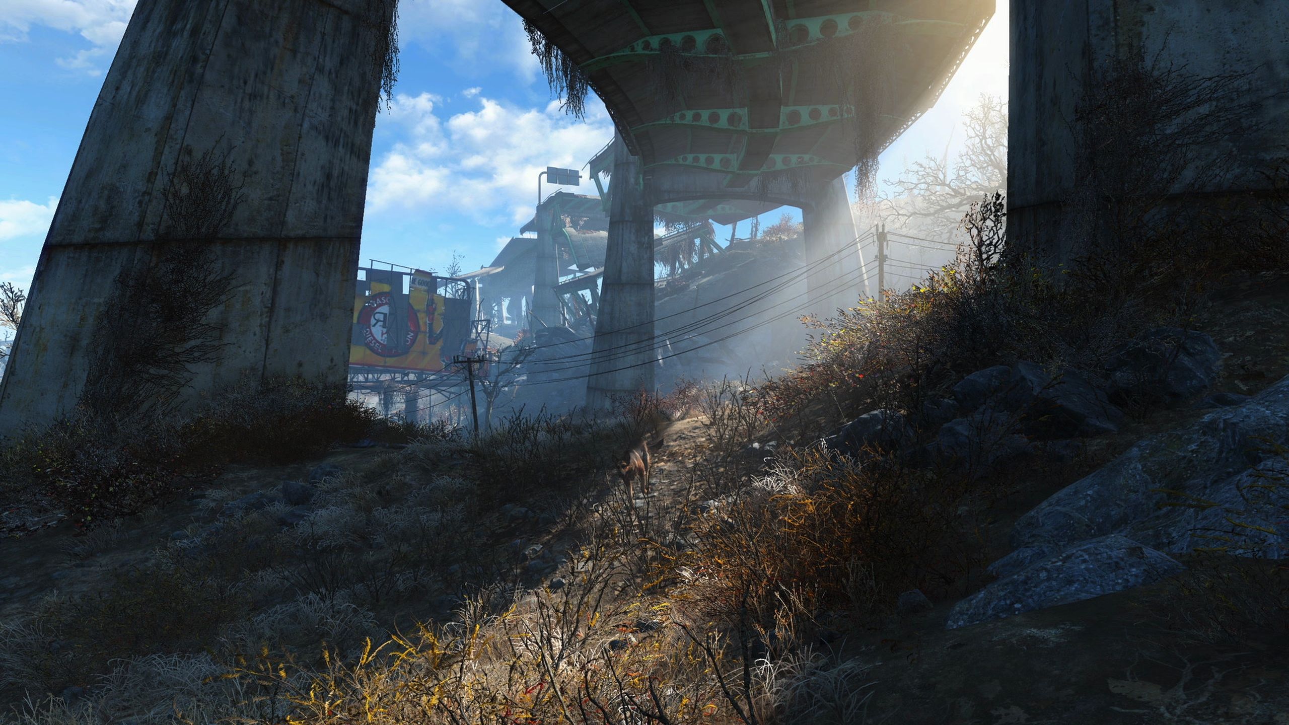 Sunlight peeking under a deserted bridge in Fallout 4.