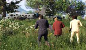 Three people crouching and holding weapons, walking through a grassy field in GTA V.
