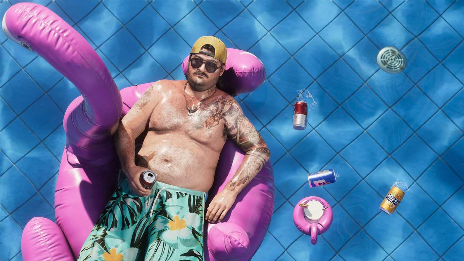 A man floating in a pool on a flamingo tube in GTA VI.