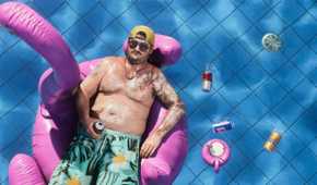 A man floating in a pool on a flamingo tube in GTA VI.