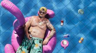 A man floating in a pool on a flamingo tube in GTA VI.