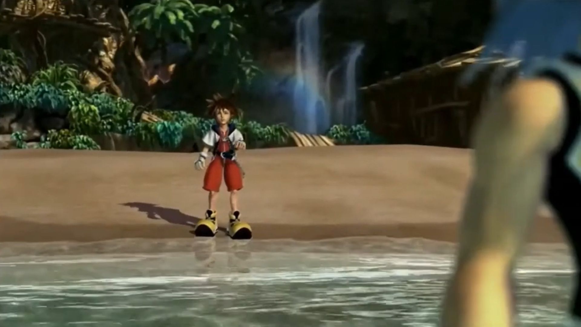 A screenshot of Sora on a beach seeing Riku ahead in Kingdom Hearts
