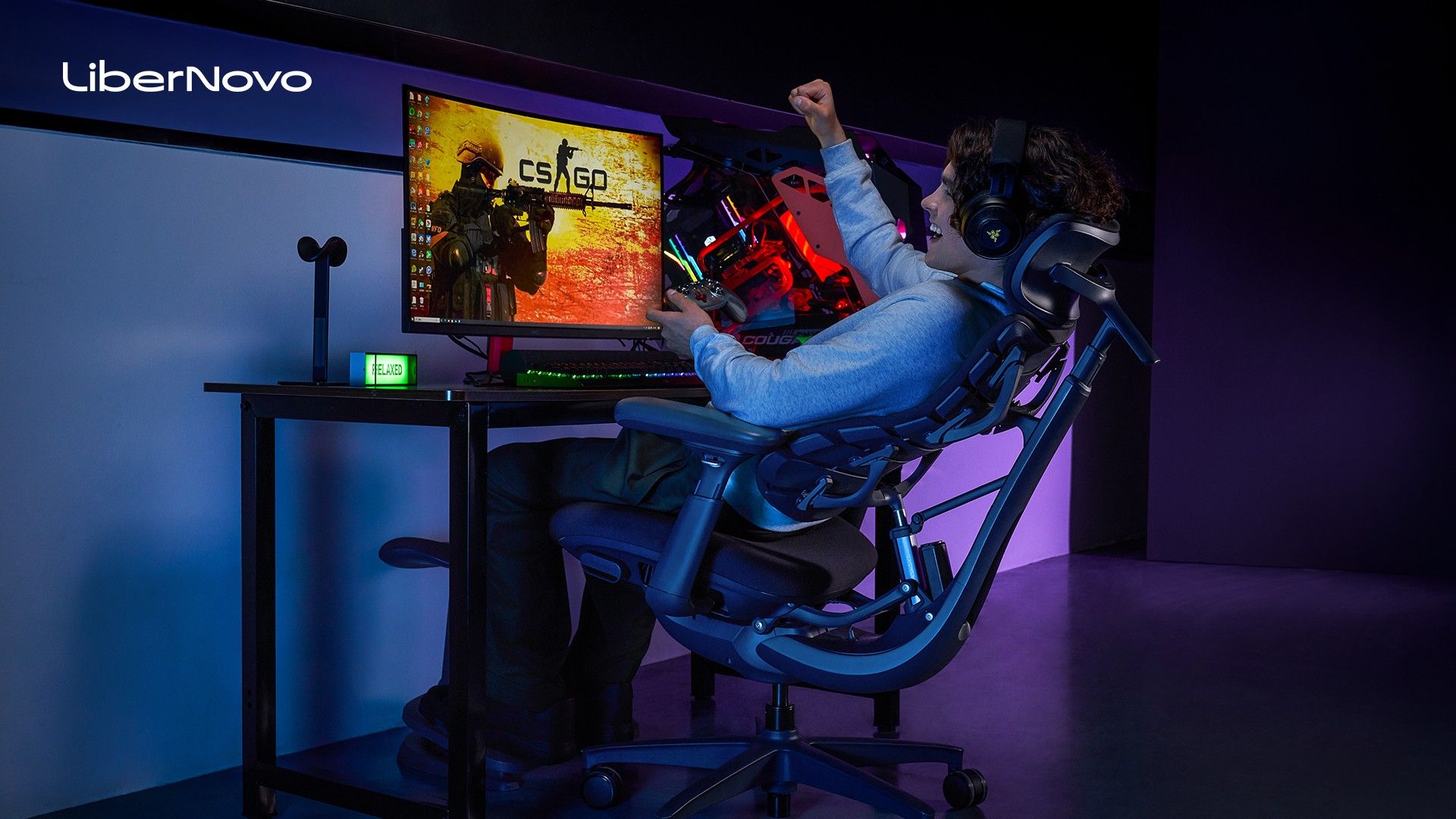 Man sitting on a reclined chair.