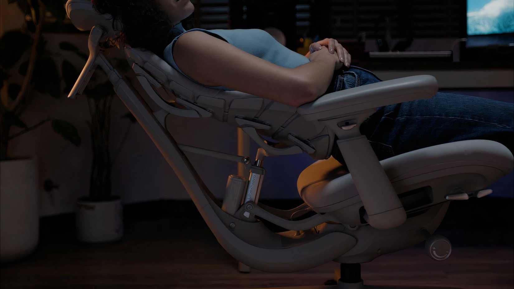 Person sitting on a reclined chair.