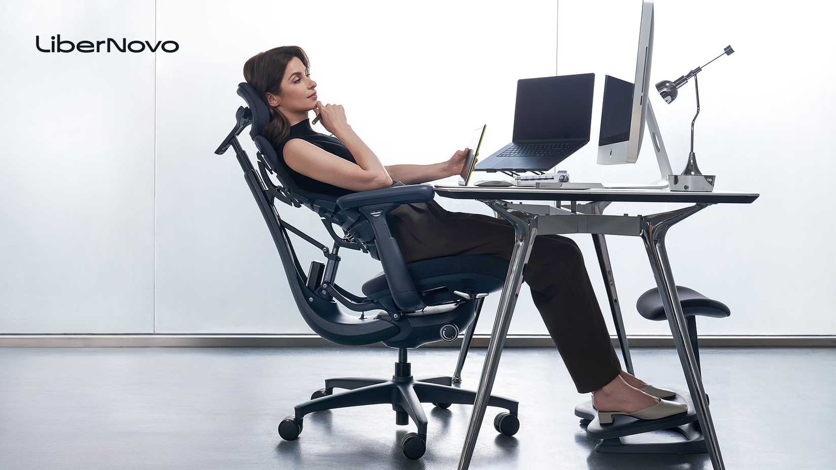 Woman leaning on a chair