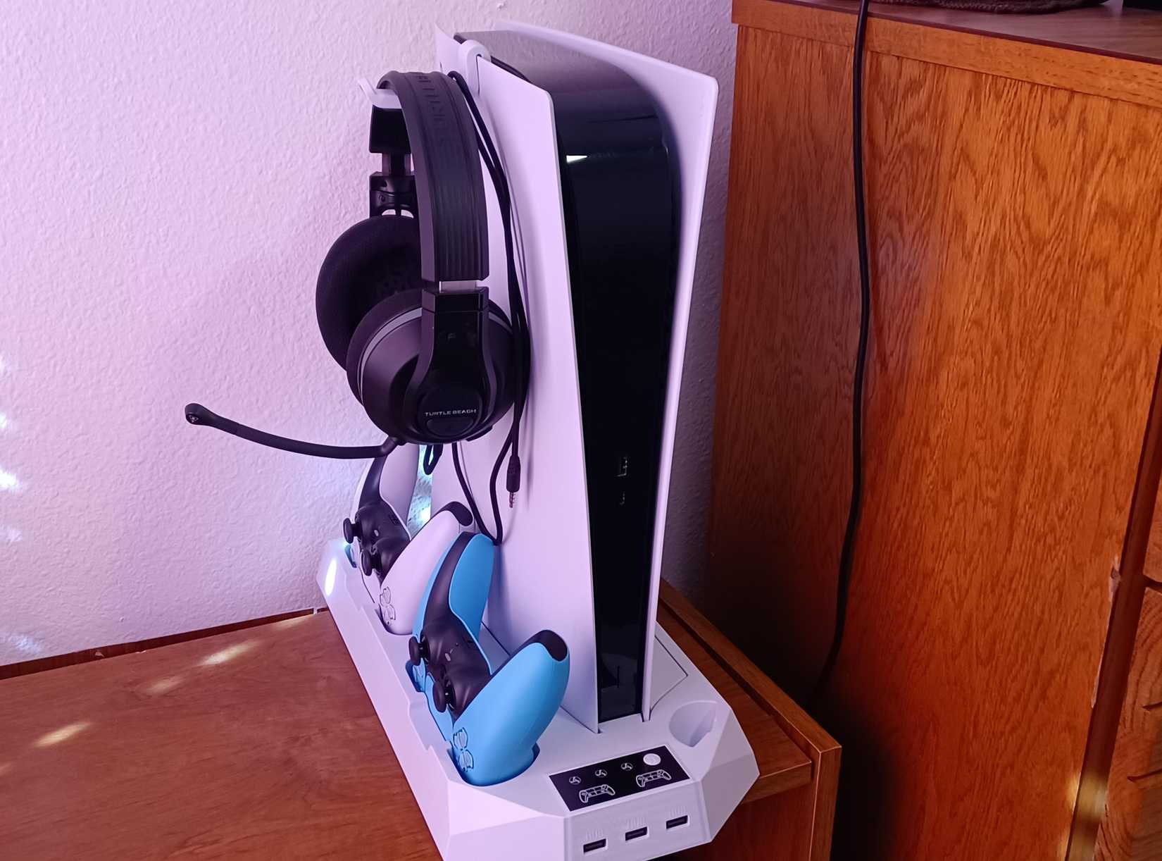 A shot of a cooling stand for the PlayStation 5 and DualSense Controllers