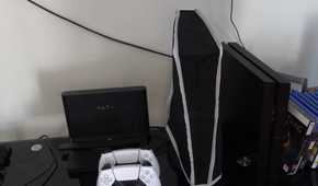 A shot of a setup with a nylon dust cover over the PlayStation 5