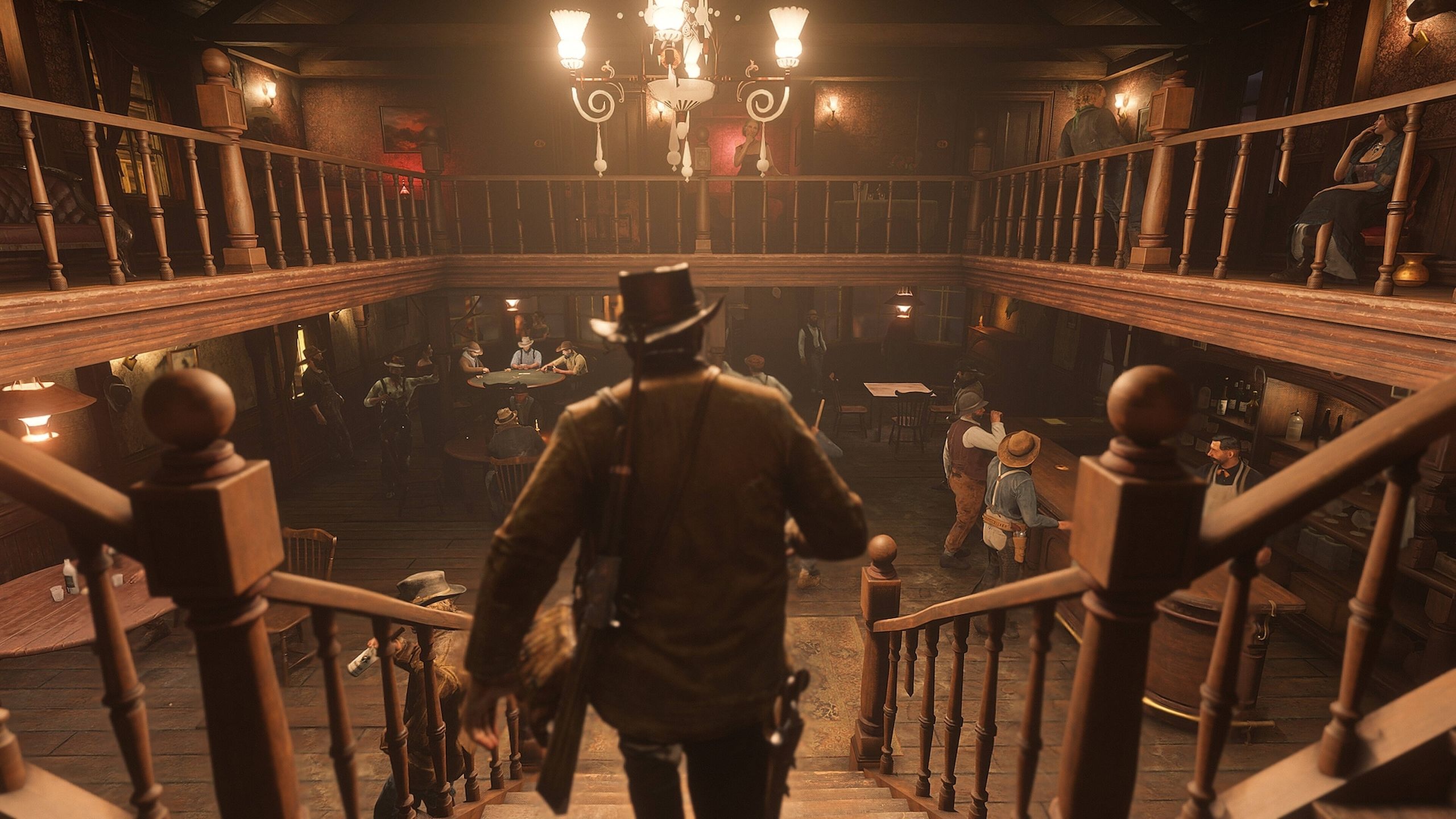 Arthur Morgan walking down the stairs in a tavern in Red Dead Redemption 2.