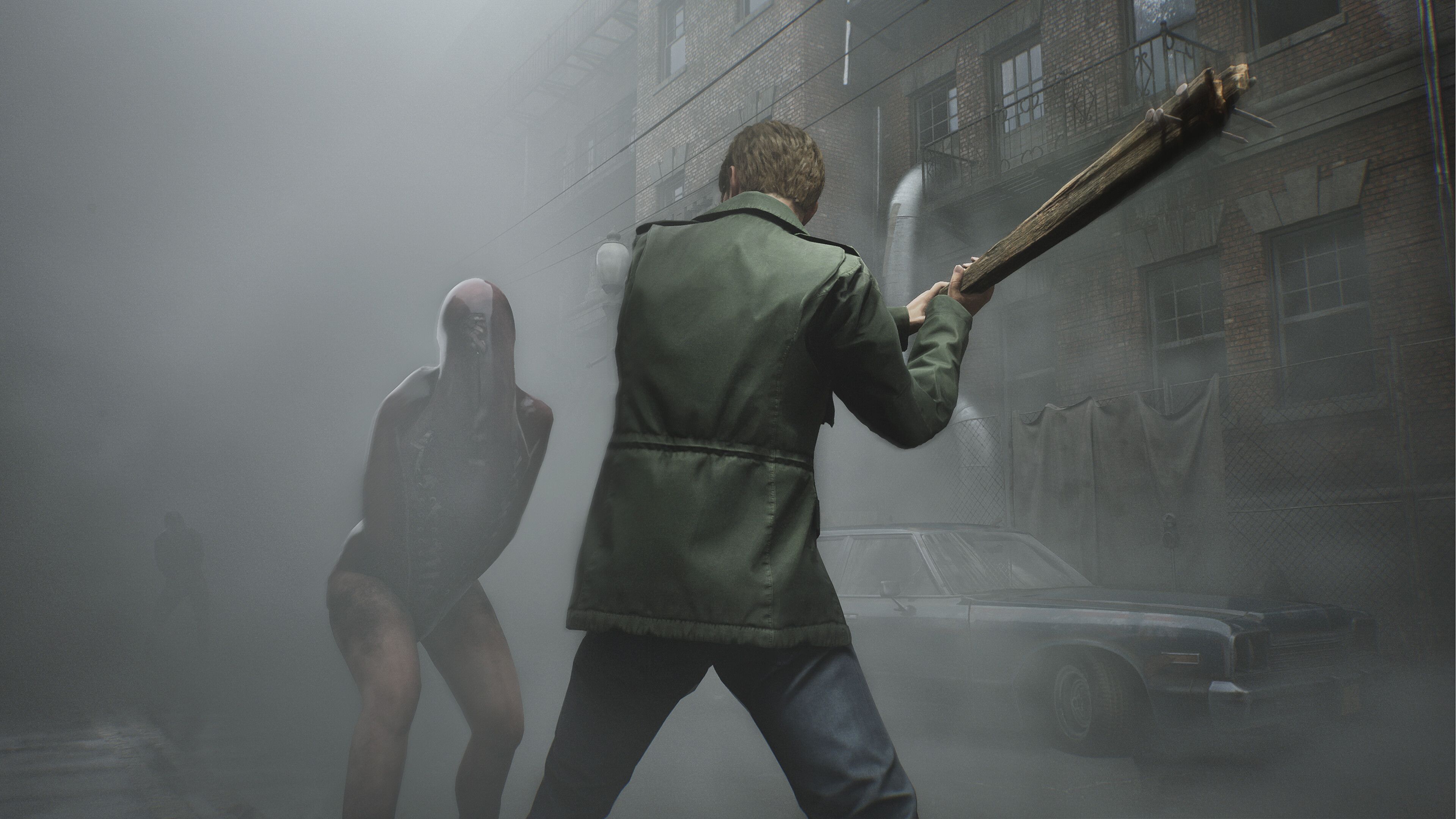 James swinging a wooden club at a Lying Figure in the Silent hill 2 remake.