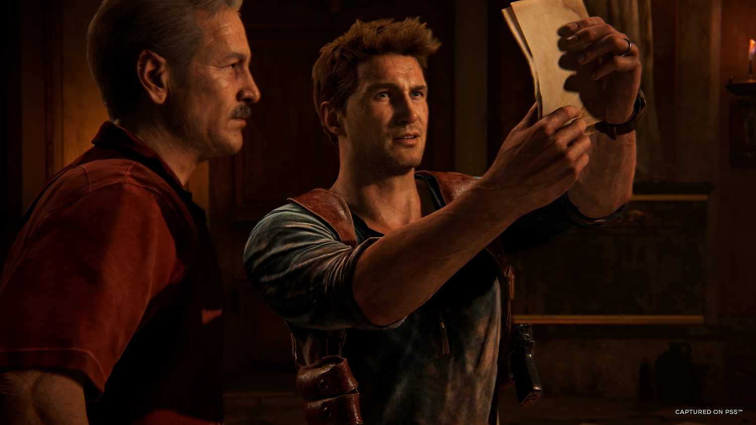 Victor Sullivan and Nathan Drake looking at a map in Uncharted 4.