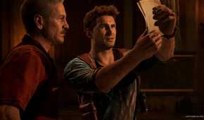 Victor Sullivan and Nathan Drake looking at a map in Uncharted 4.