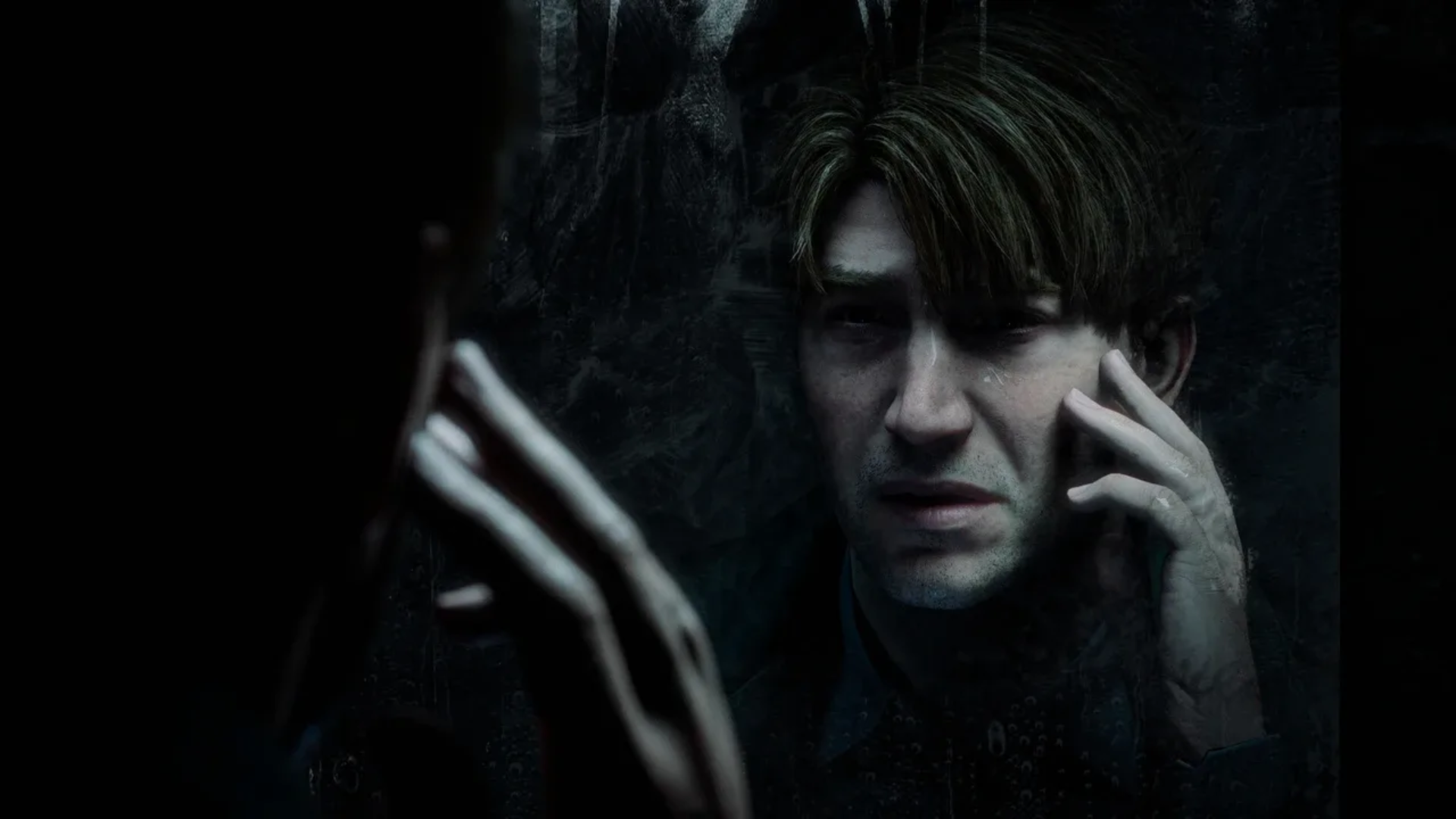 A man talking on the phone while staring into a mirror