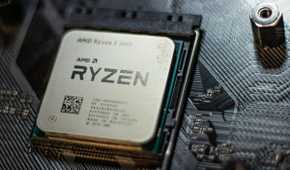 An AMD CPU installed on a black motherboard
