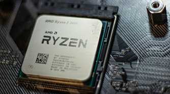 An AMD CPU installed on a black motherboard
