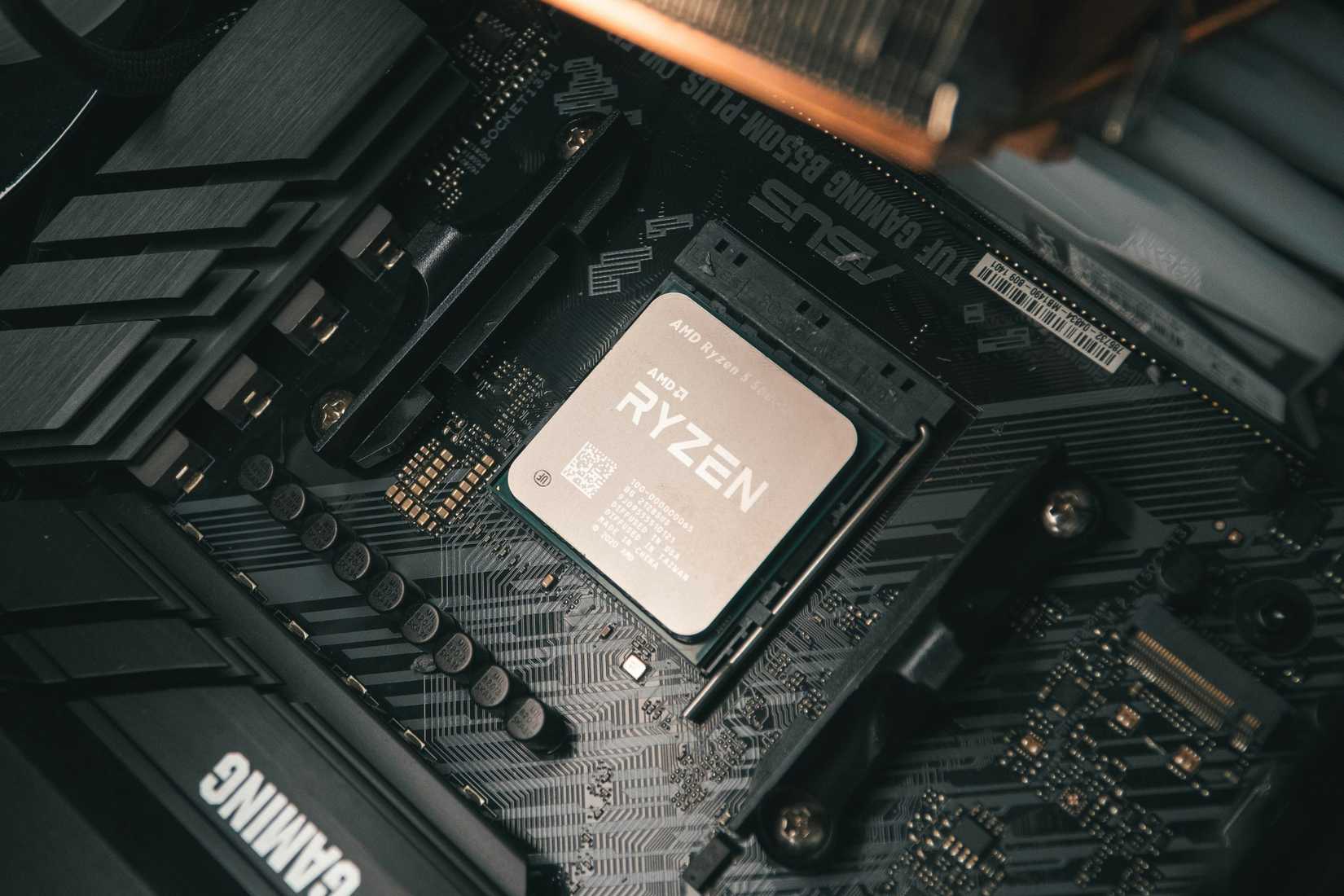 An AMD Ryzen 5000 series CPU installed on a motherboard. 