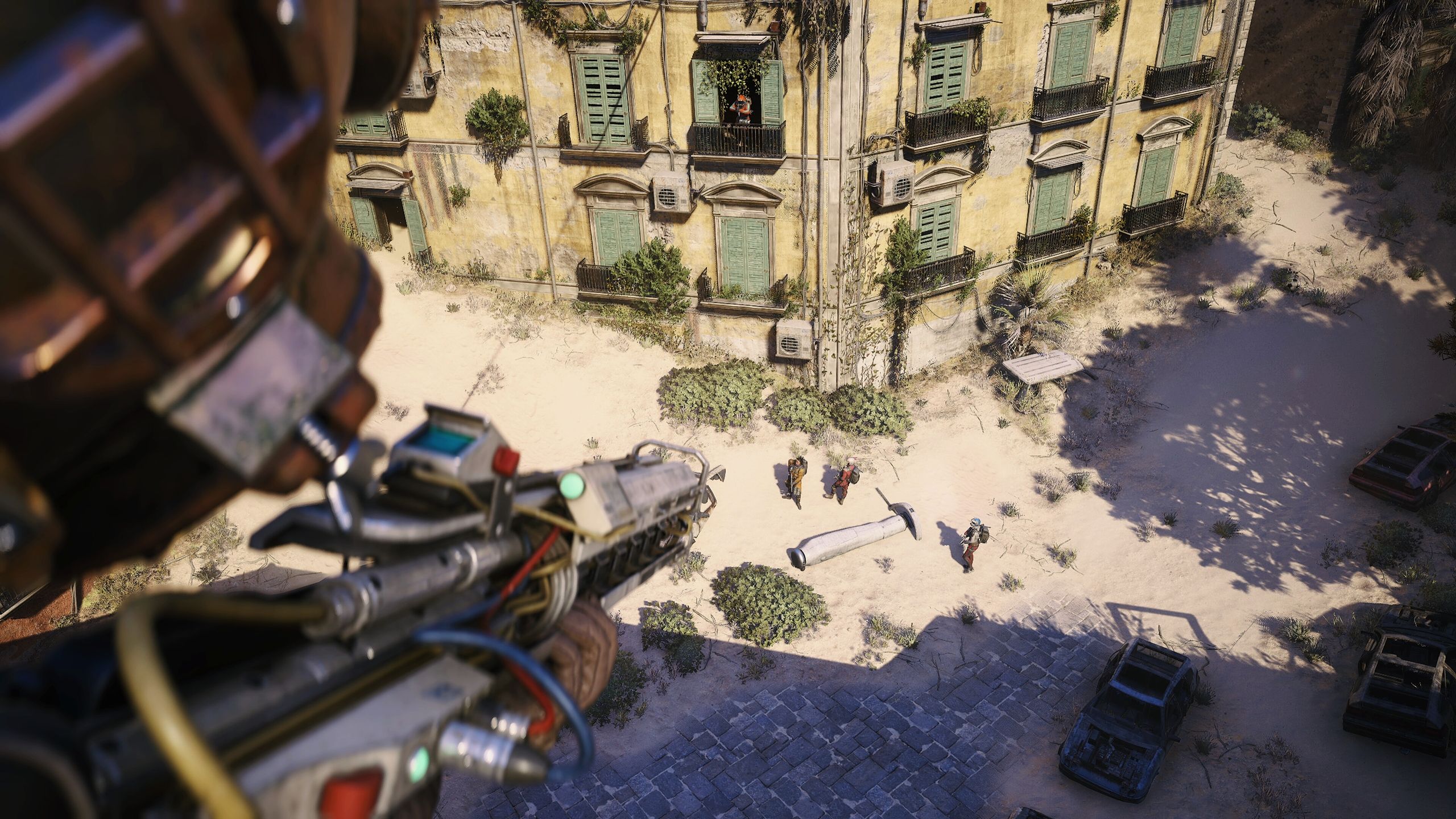 Aiming down at a trio of players in Arc Raiders.