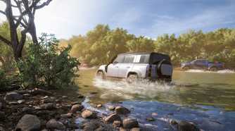 A Land Rover Defender wading through water in Forza Horizon 5.