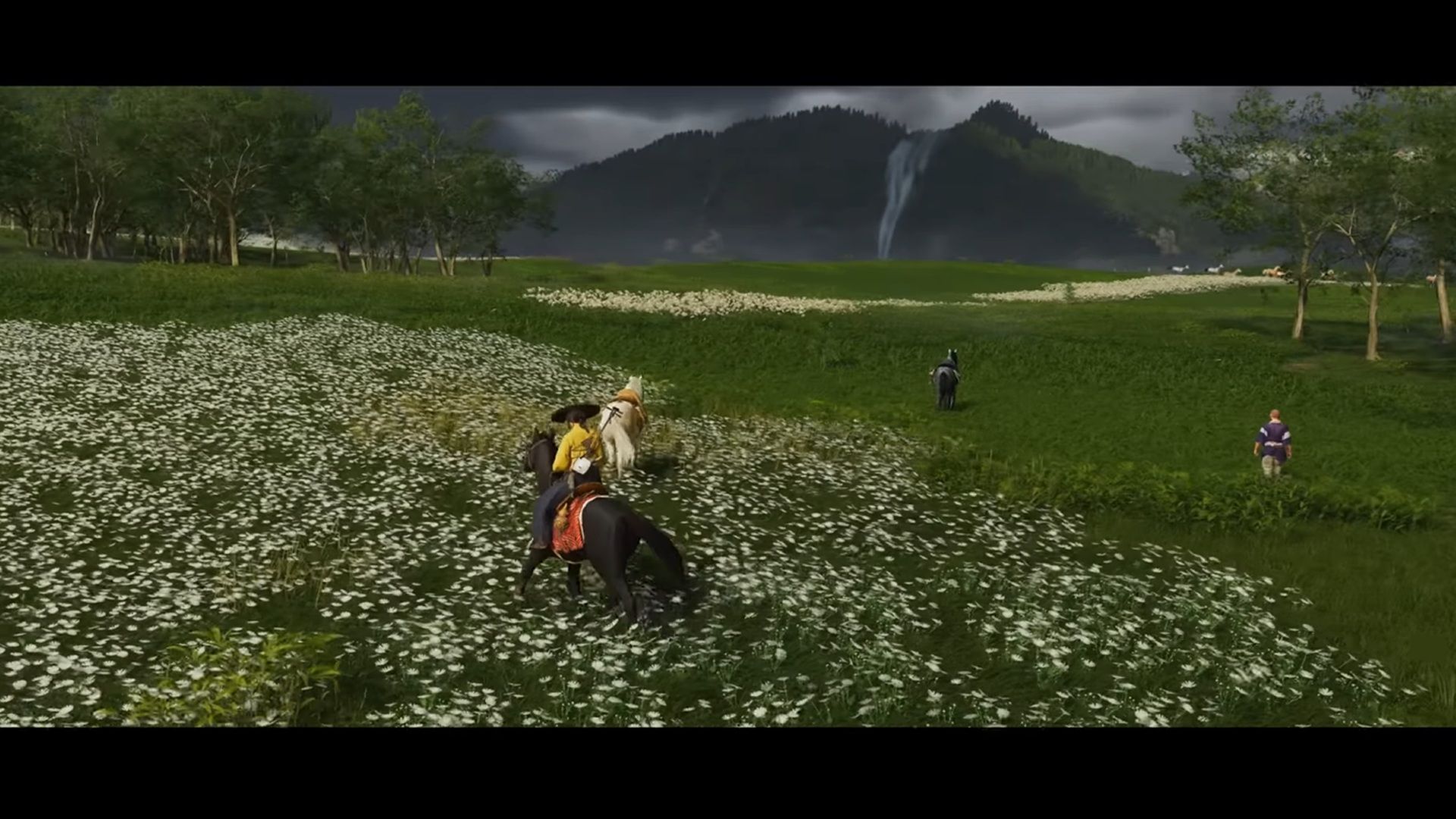 A screenshot of Atsu riding on horseback near multiple horses and people in Ghost of Yotei