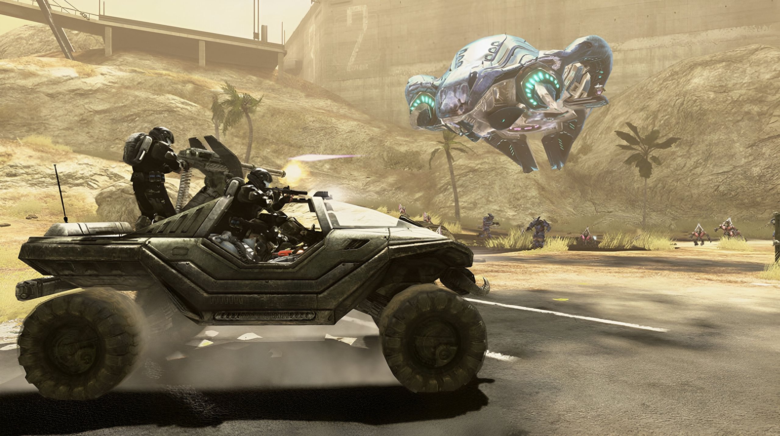 A gunner in a Warthog shooting at a flying alien ship.