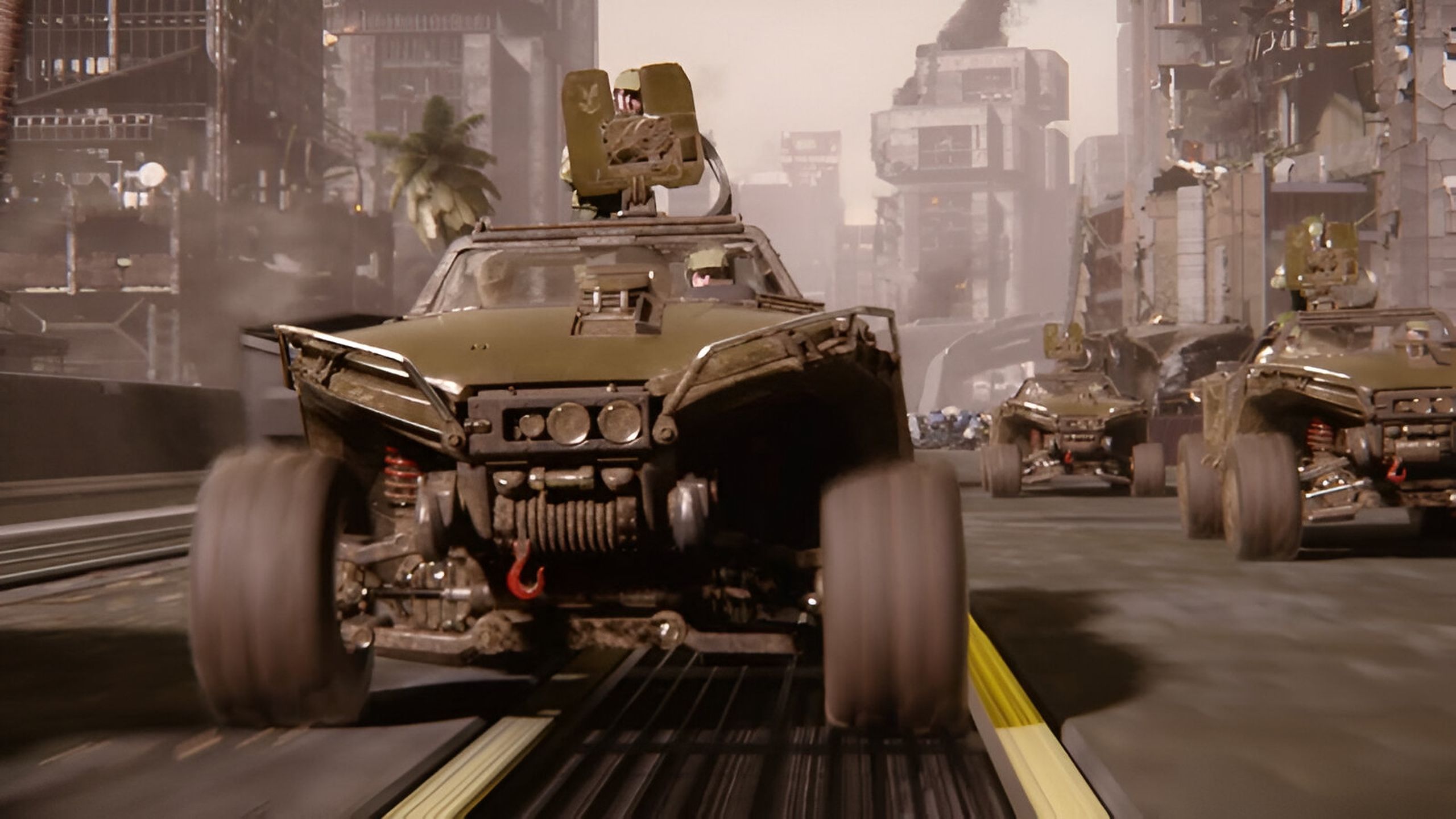 Warthogs in Halo racing down a road.