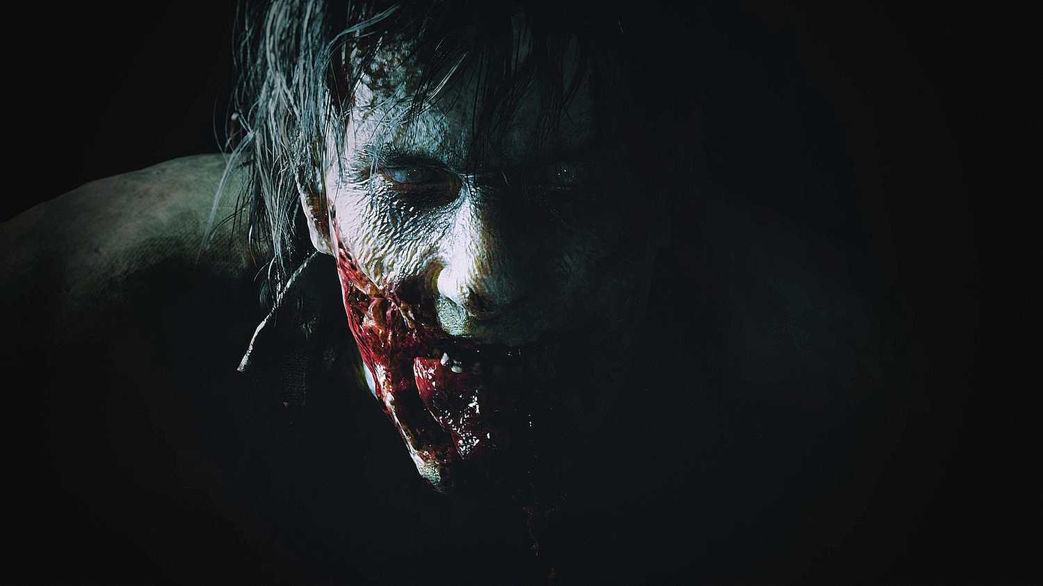 A close-up of a bloodied zombie face in Resident Evil 2 remake.