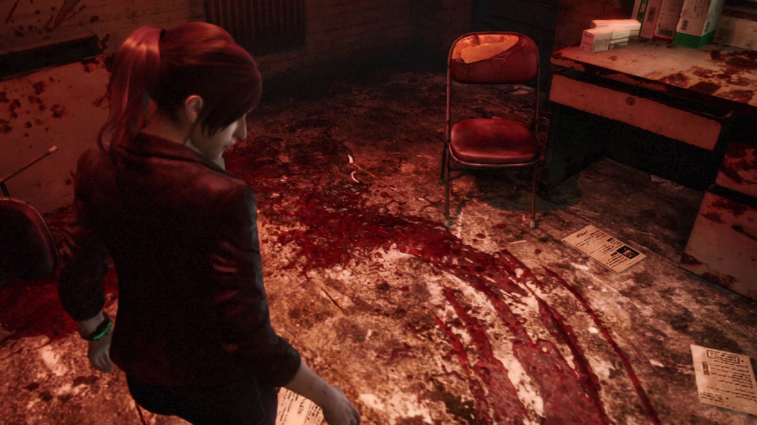 Claire Redfield looking at a pool of blood on the floor.