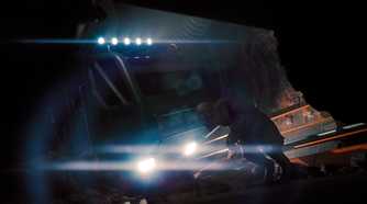 A monstrous creature standing in front of a crashed truck's headlights in SCP: Fragmented Minds.
