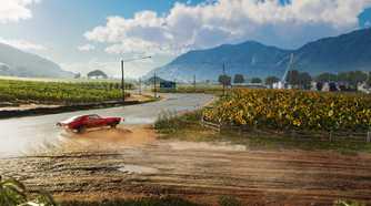 A muscle car drifting next to sunflower fields in Hawaii in The Crew: Motorfest.