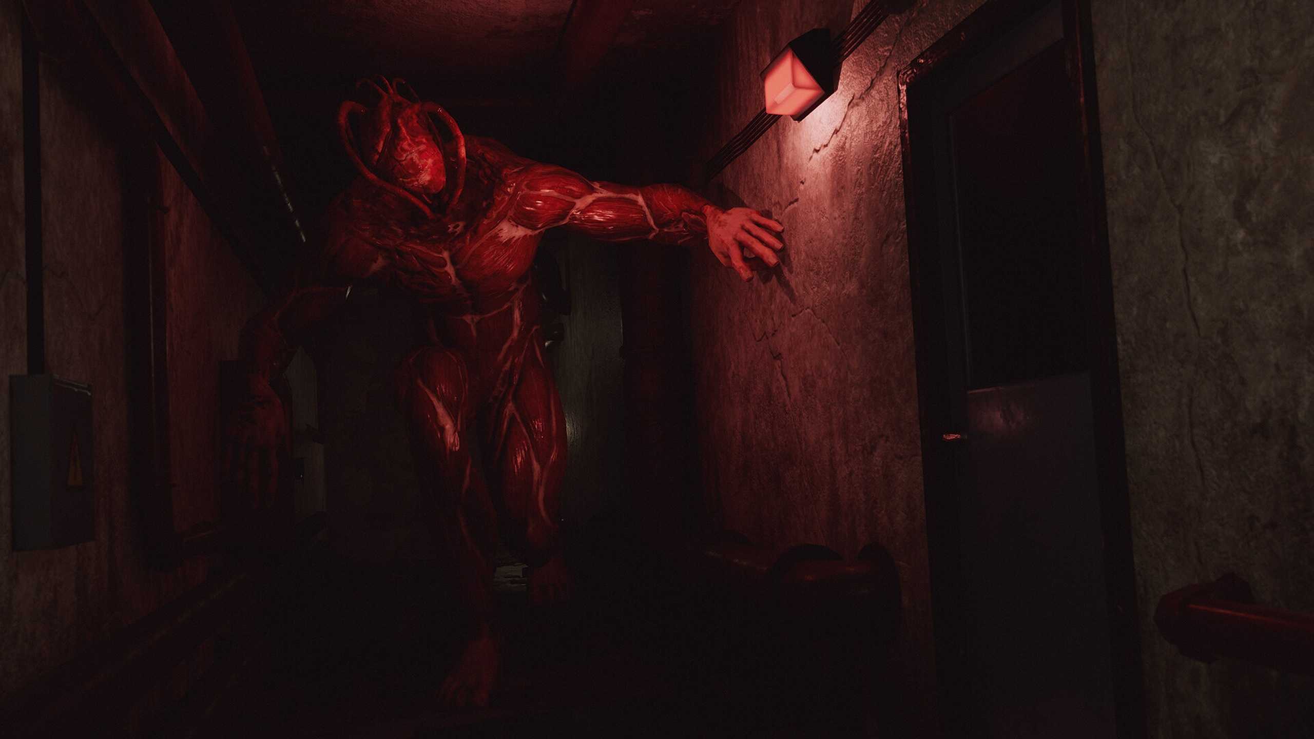 A monster bathed in red light in The Inn-Sanity.