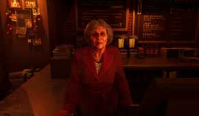 An old lady behind a bar counter in Vampire: The Masquerade – Bloodlines 2.