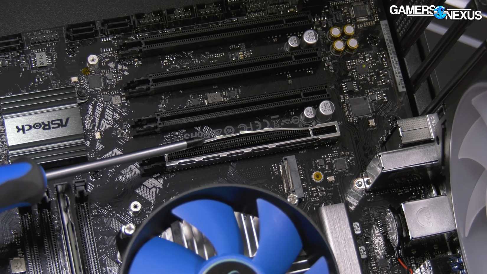 A still frame of the metal reinforcement on a PCIe slot being bent