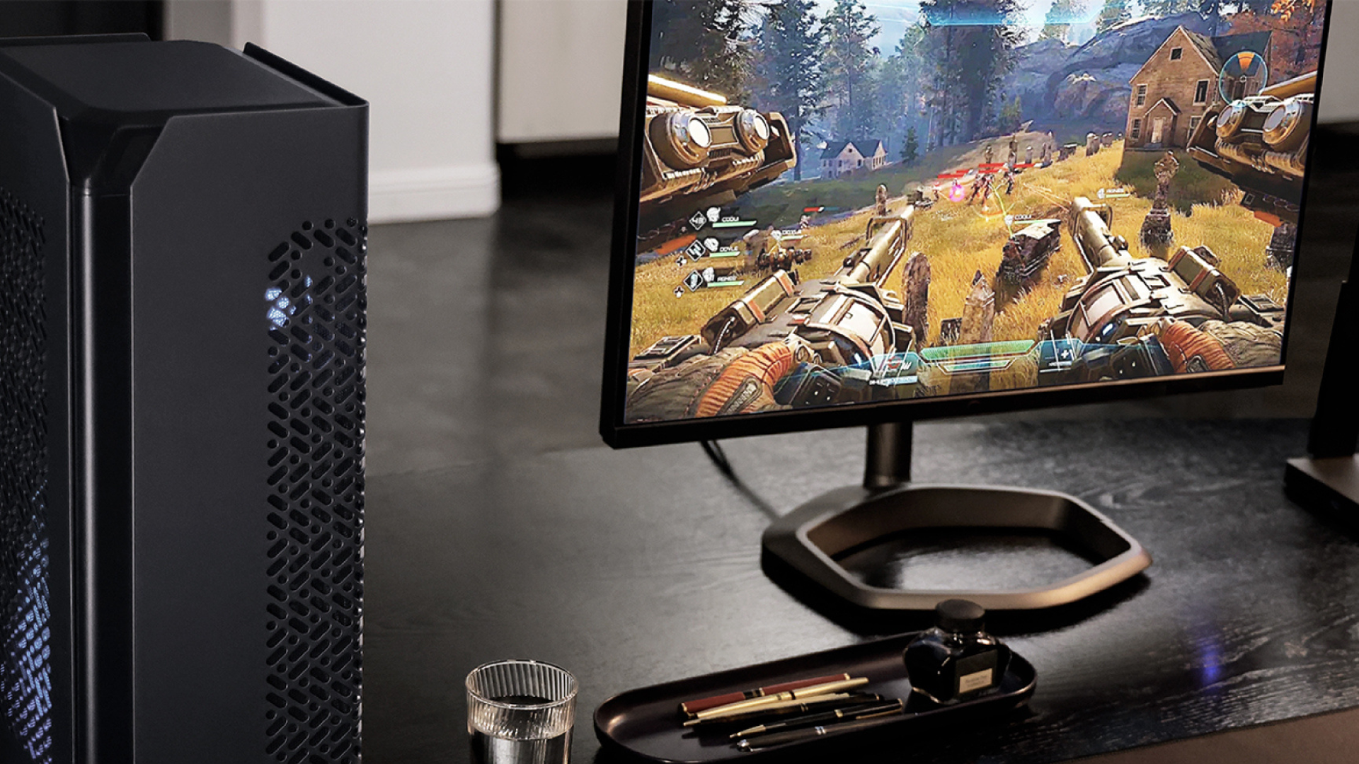 Cooler Master NCORE 100 MAX Mini-ITX PC Case on a desk next to monitor