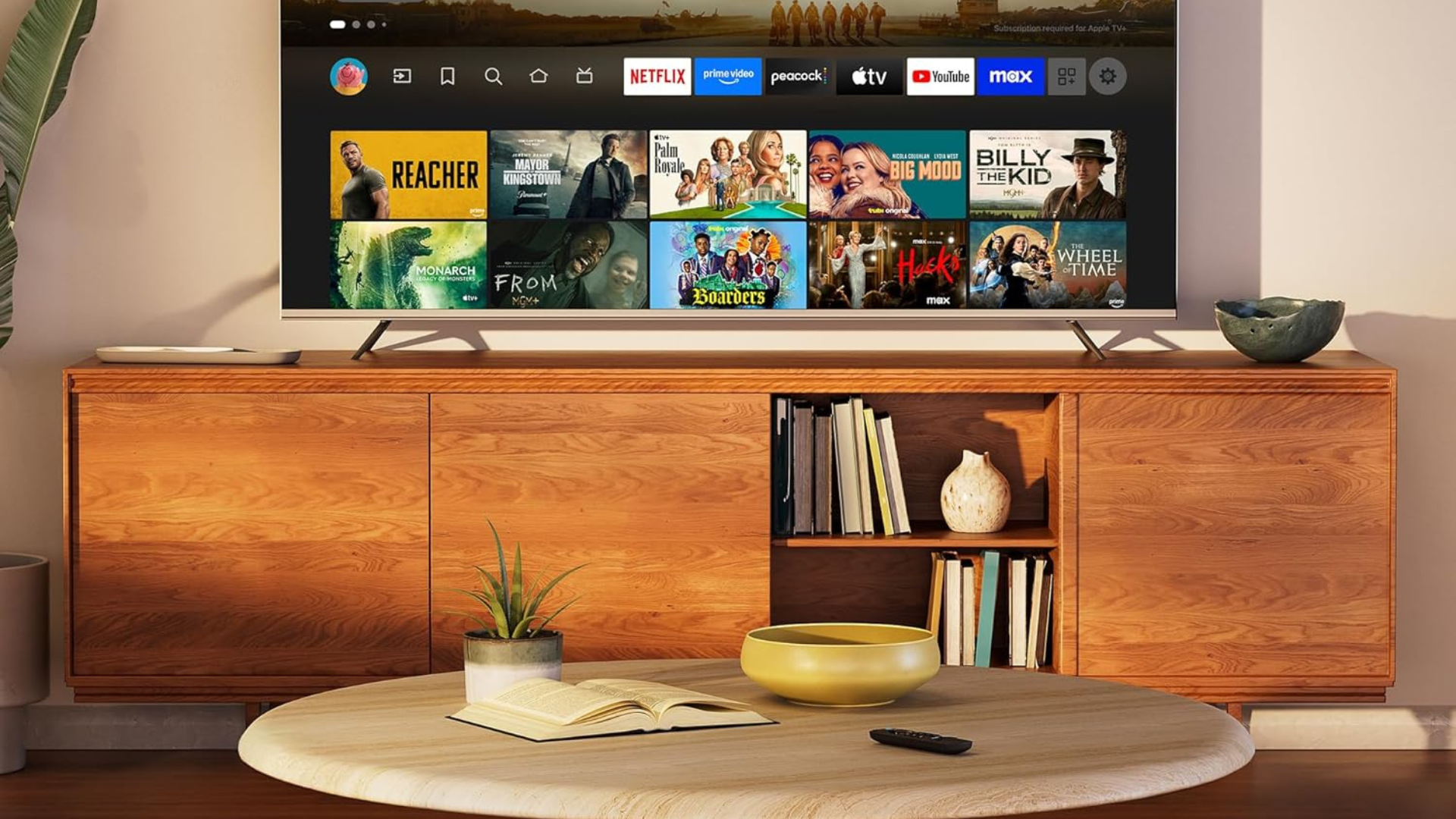Amazon Fire TV Stick HD on the tablet in front of TV